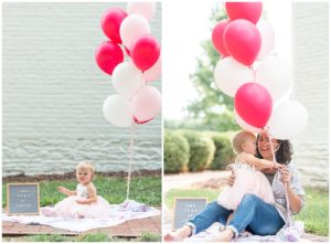 baby girl in a pink dress with her mother and balloons