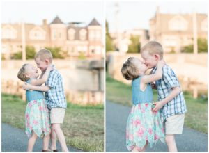 a brother and sister give kisses and hugs to each other