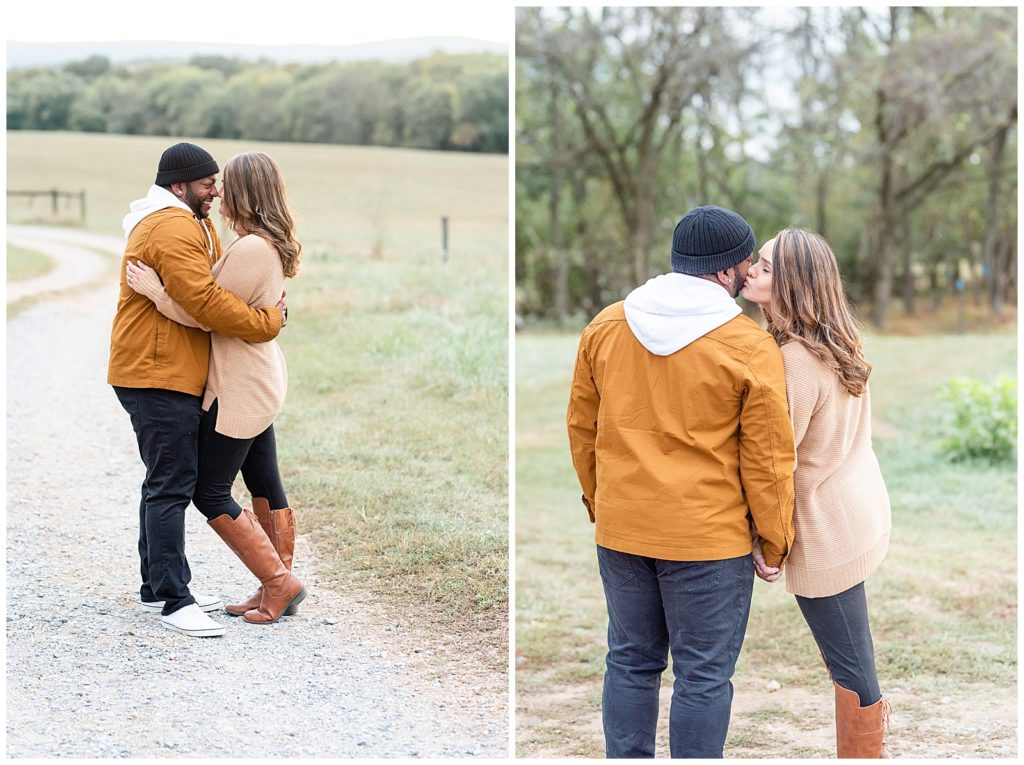 a mom and dad kiss each other on a gravel road in a fall family session