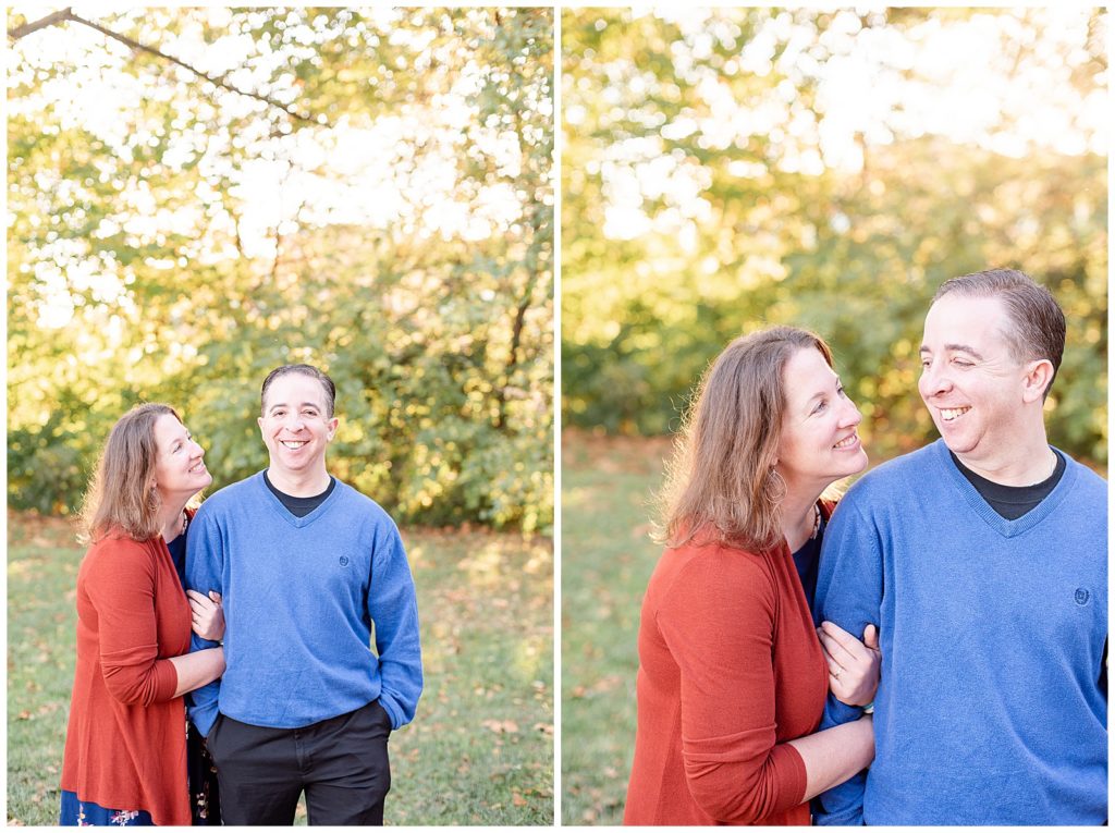 a couple looks at each other and smiles for fall mini session