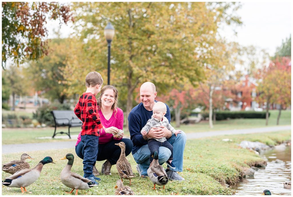 a family of 4 feed ducks at baker park